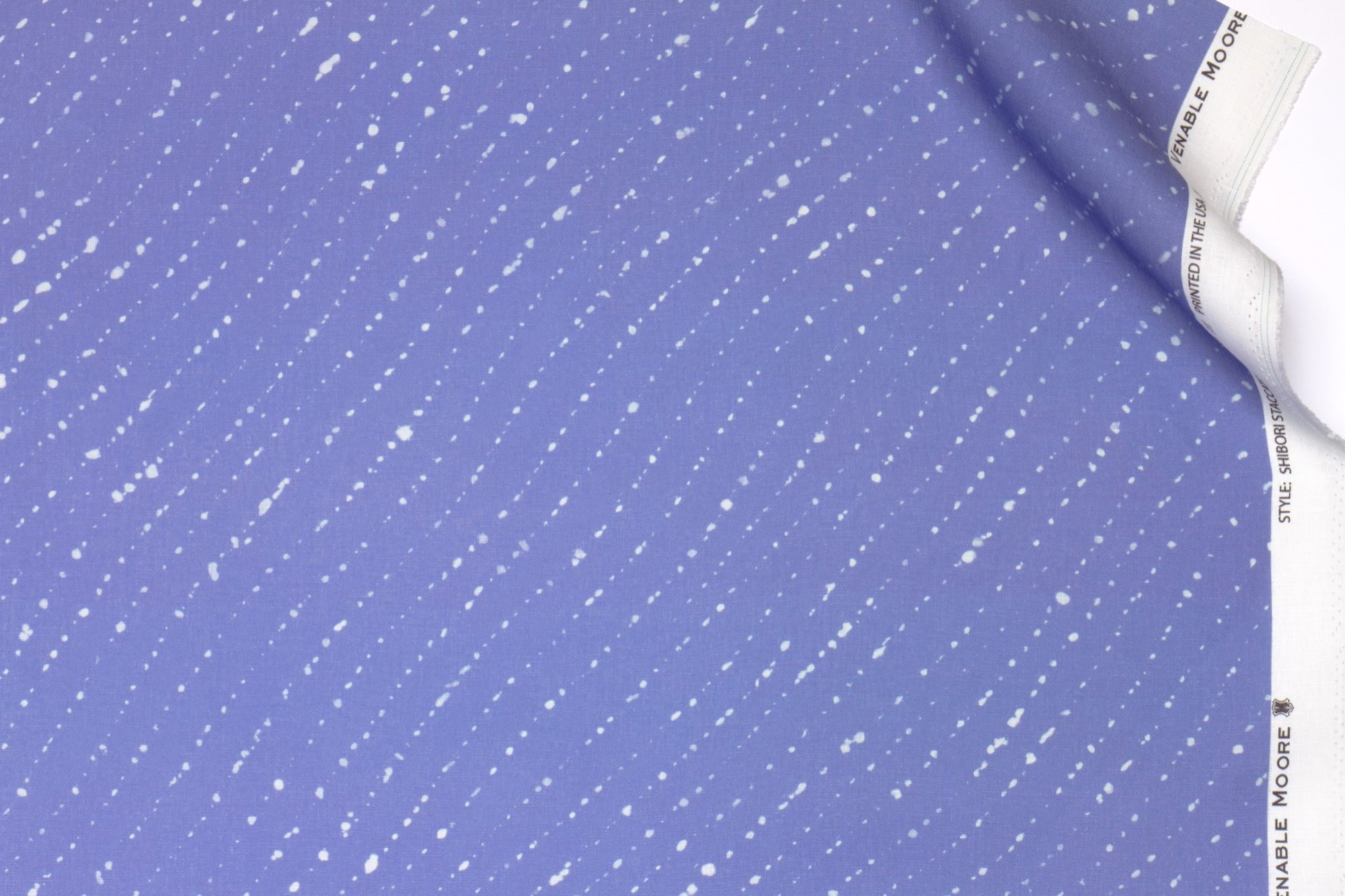 Venable moore 100% european linen staccato sbiancato shibori fabric by the yard in clear cornflower blue with top fold against white background