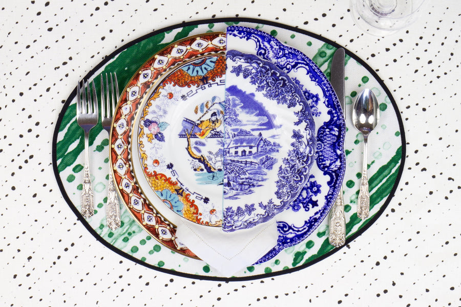 Place setting with 100% linen glissando shibori emerald green placemat on alabaster shibori linen with colored plates