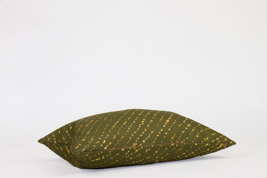 Side view 12” x 20” 100% linen staccato decolorato shibori pillow in fern green with hidden zipper
