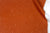 Venable moore 100% european linen staccato sbiancato shibori fabric by the yard in earthy ginger orange with top fold against white background