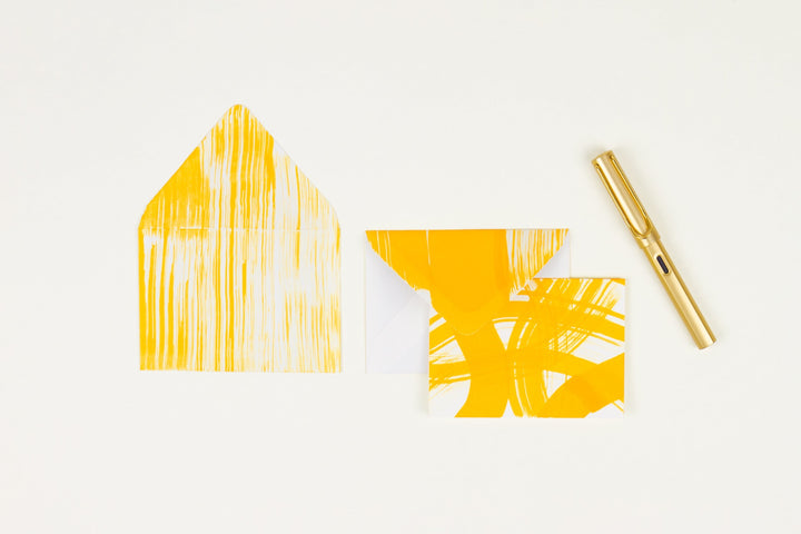 Hand-painted card and crimson lined envelopes in goldenrod yellow in ‘stripes and squiggles’ pattern with gold pen