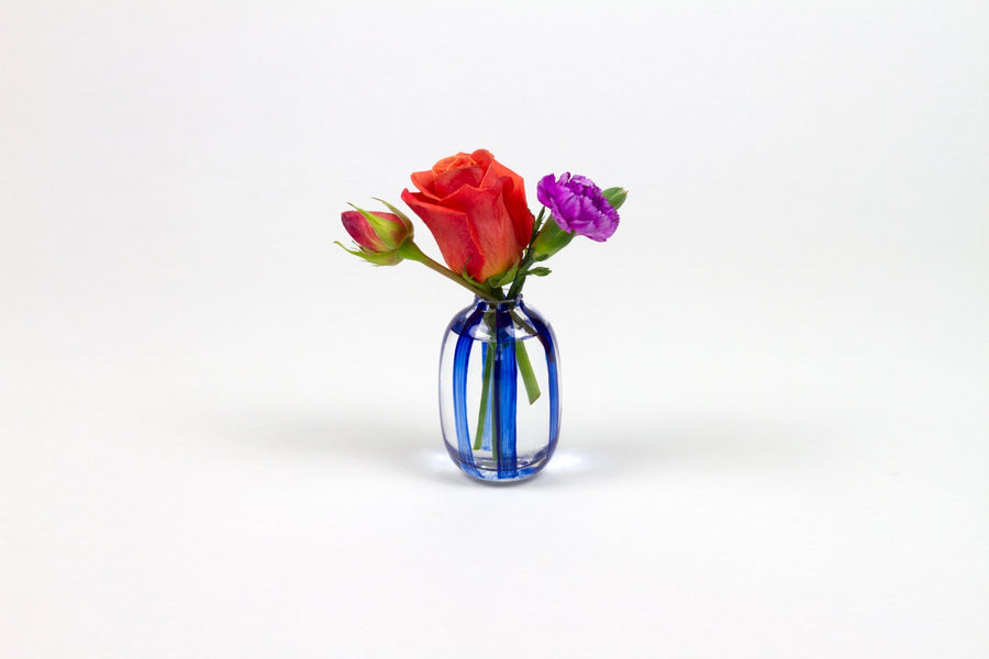 Hand-painted striped glass bud vase in lapis blue with roses and carnation