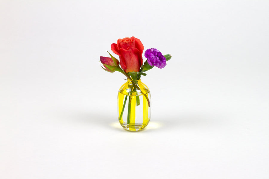 Hand-painted striped glass bud vase in sun yellow with roses and carnation