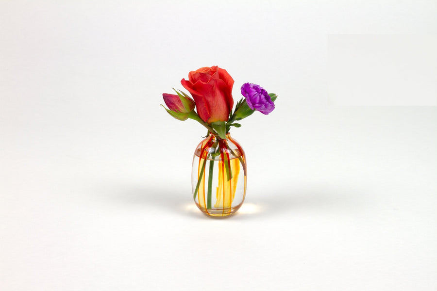 Hand-painted striped glass bud vase in tangerine orange with roses and carnation