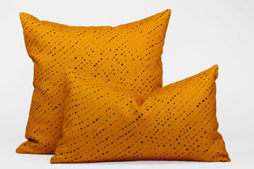 Two 100% linen staccato nero shibori pillows in marigold yellow, 20” x 20” and 12” x 20”
