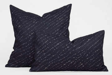 Two 100% linen staccato decolorato shibori pillows in midnight blue, 20” x 20” and 12” x 20”