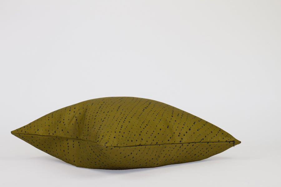 Side view 20” x 20” 100% linen staccato nero shibori pillow in moss green with hidden zipper