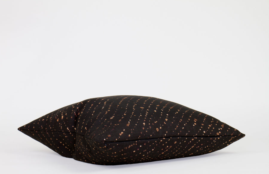 Side view 20” x 20” 100% linen staccato decolorato shibori pillow in onyx black with hidden zipper