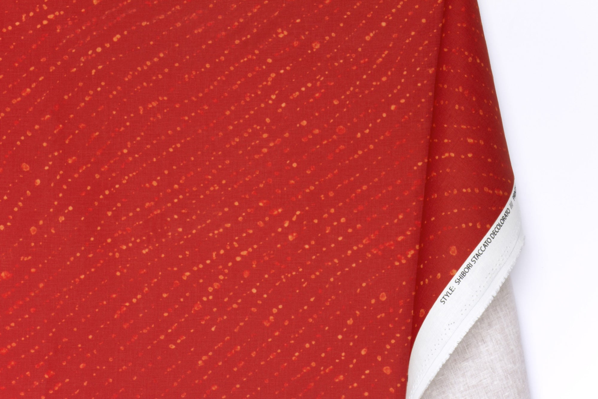 100% linen staccato decolorato shibori fabric by the yard with long fold in paprika red