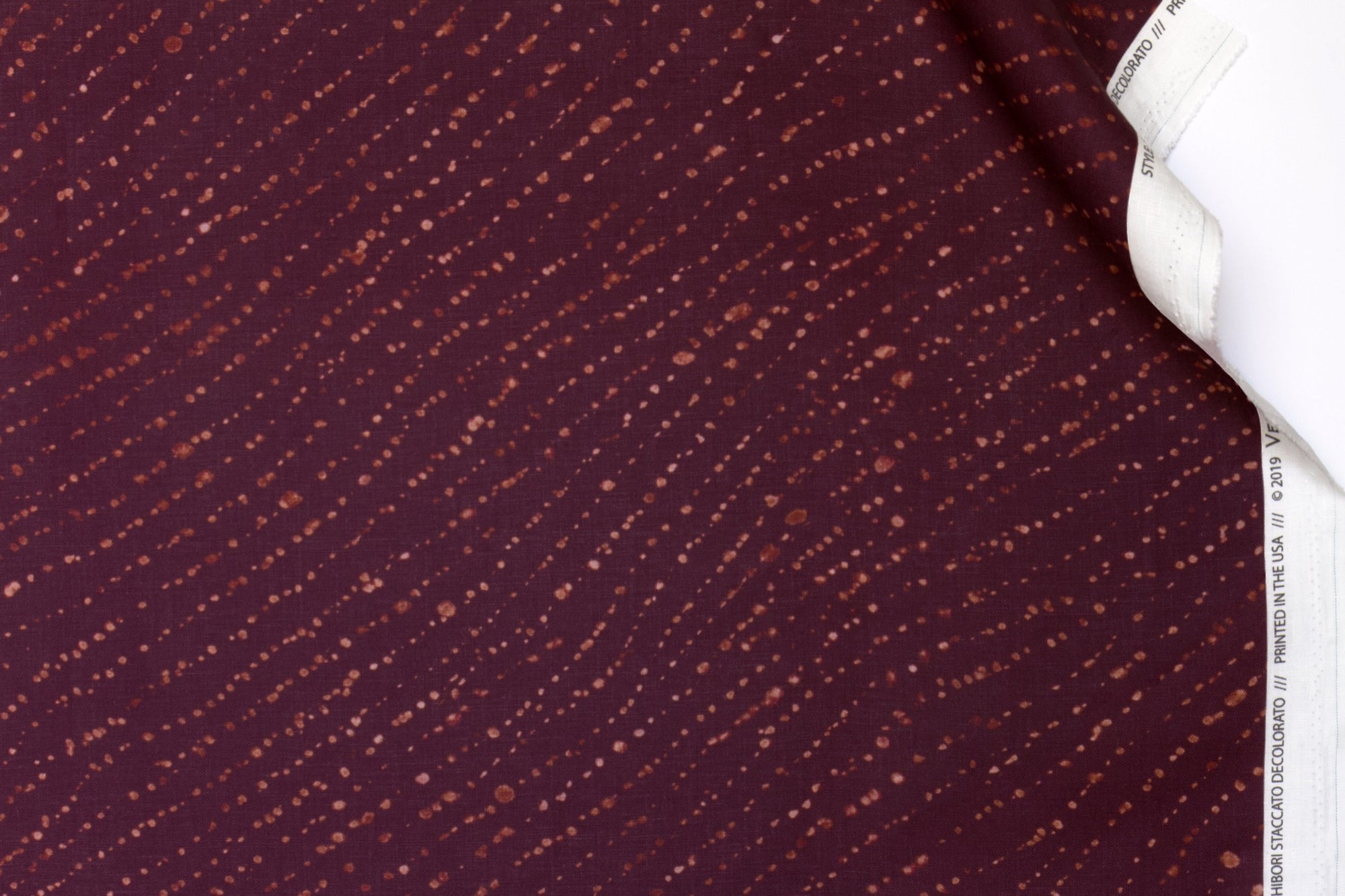 100% linen staccato decolorato shibori fabric by the yard in plum purple with top fold