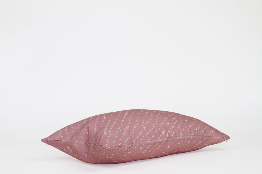 Side view 12” x 20” 100% linen staccato decolorato shibori pillow in rose clay pink with hidden zipper