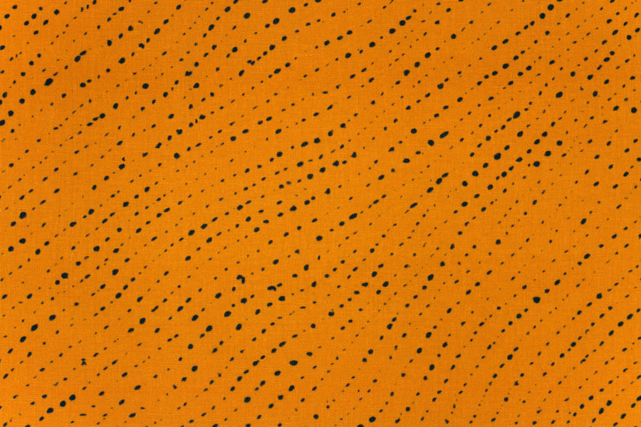 100% linen staccato nero shibori fabric by the yard up close in marigold yellow