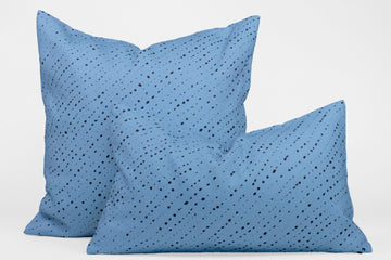 Two 100% linen staccato nero shibori pillows in sky blue, 20” x 20” and 12” x 20”