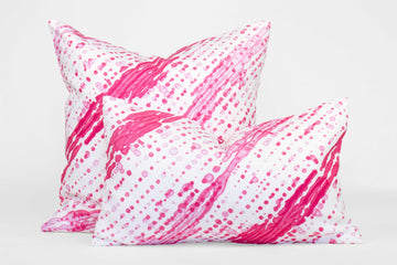 Two 100% linen glissando shibori pillows in strawberry pink, 20” x 20” and 12” x 20”