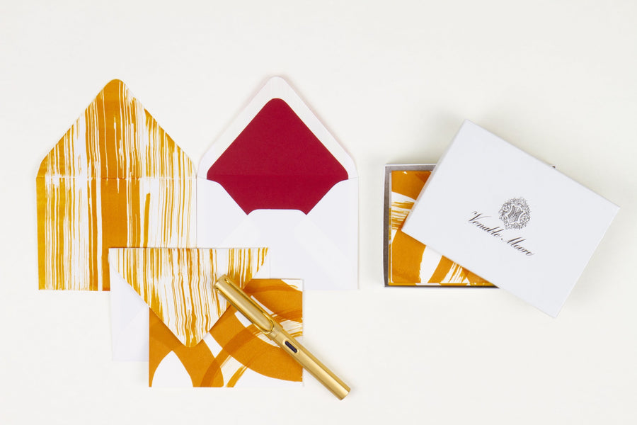 Hand-painted card and crimson lined envelopes in ochre with gold pen and Venable Moore stationery box