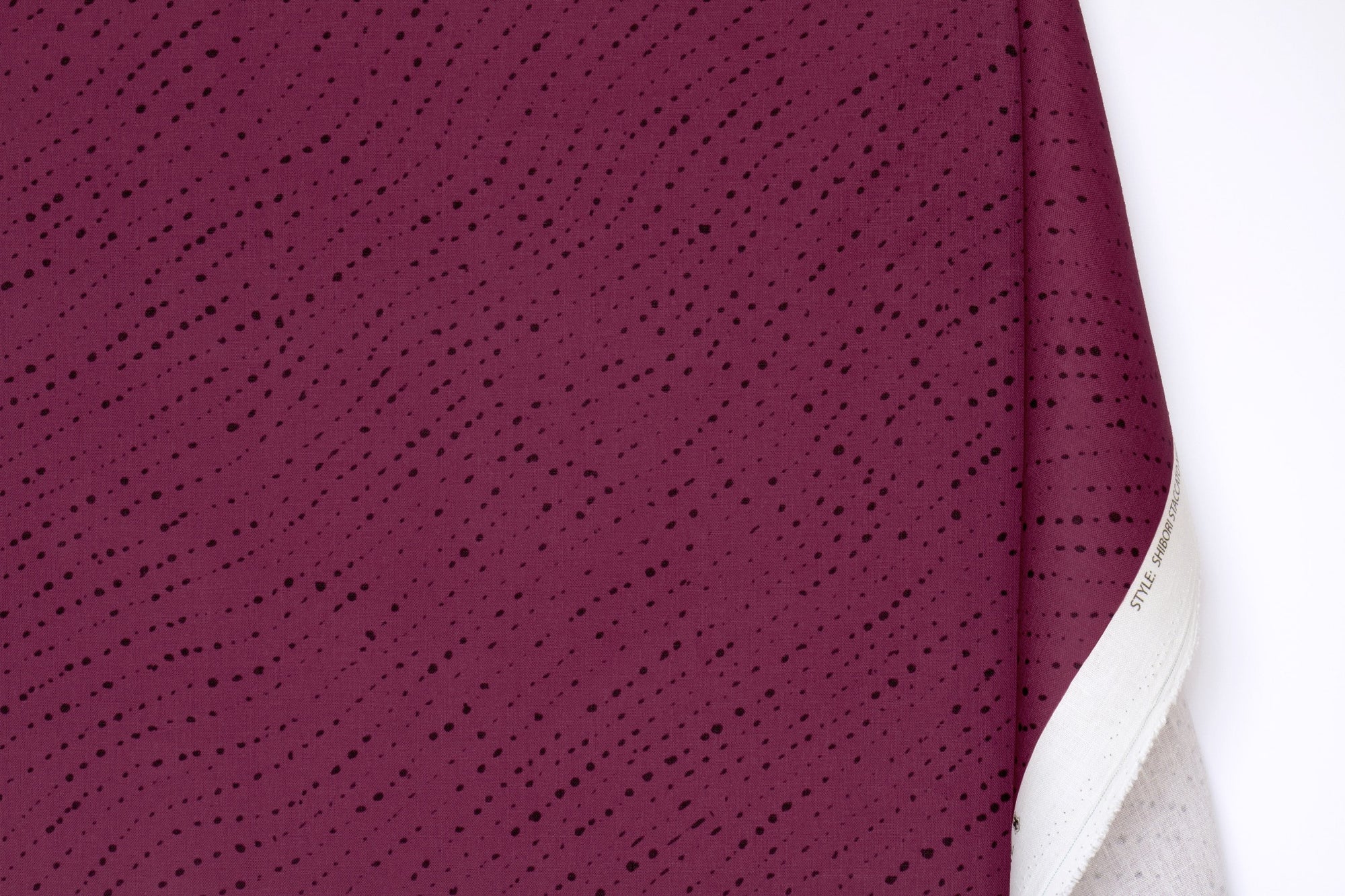 Venable Moore 100% linen staccato nero shibori fabric by the yard with long fold in cerise pink