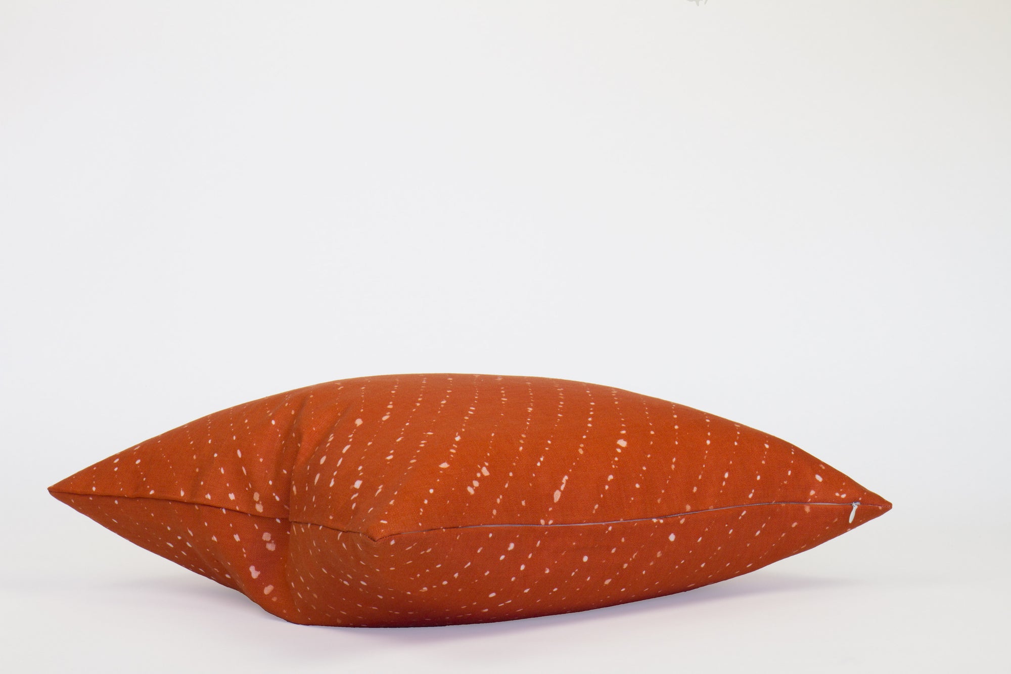 'Staccato Sbiancato' Ginger linen pillow 20" x 20" on its side 