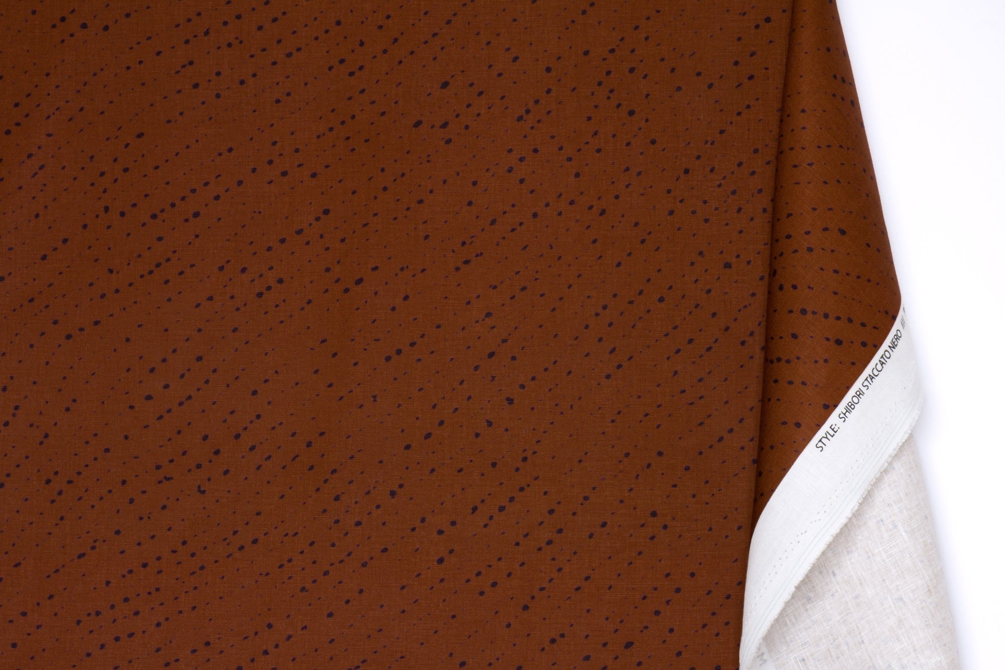 Venable Moore 100% linen staccato nero shibori fabric by the yard with long fold in russet brown