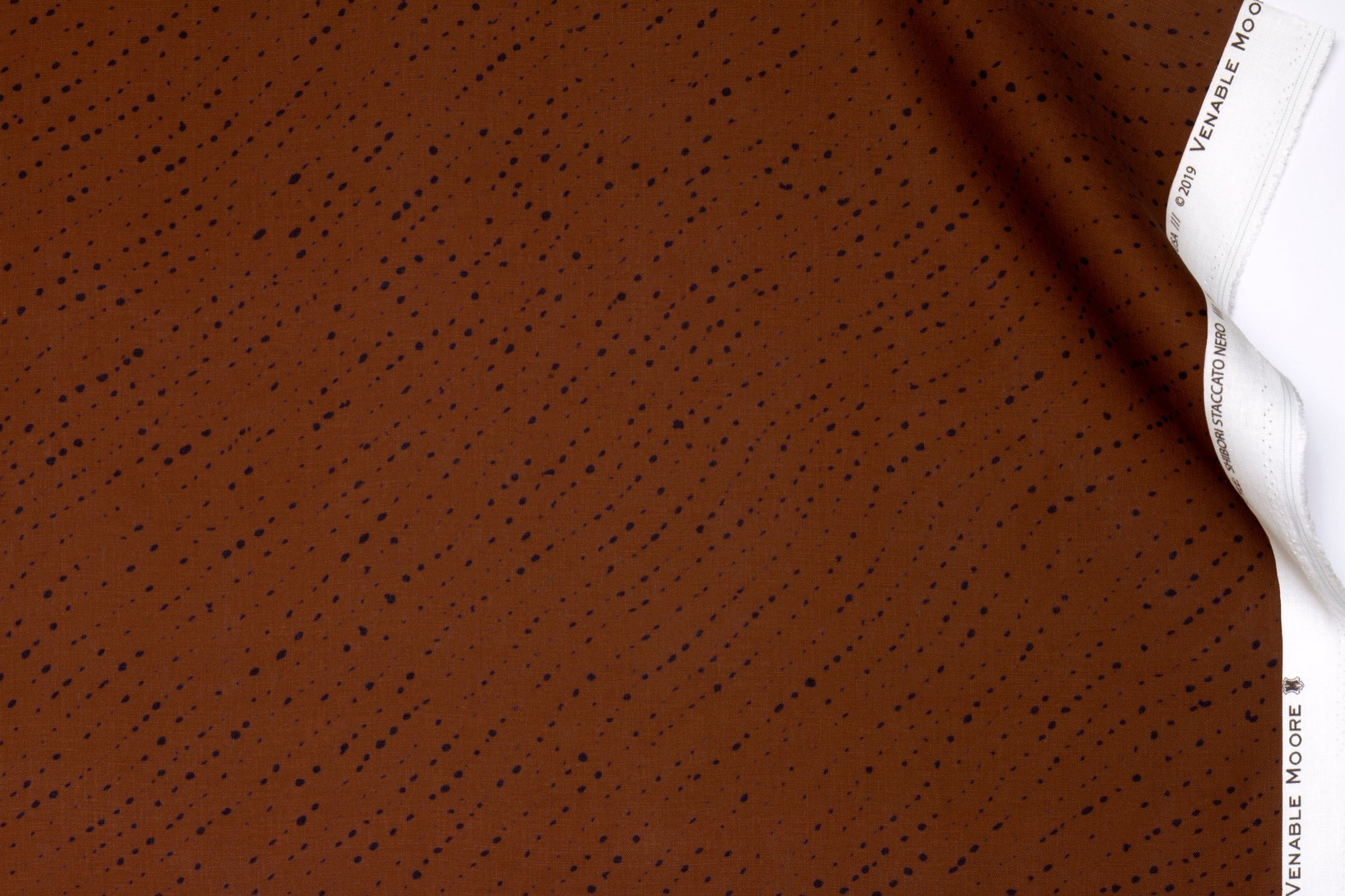 Venable Moore 100% linen staccato nero shibori fabric by the yard in russet brown with top fold
