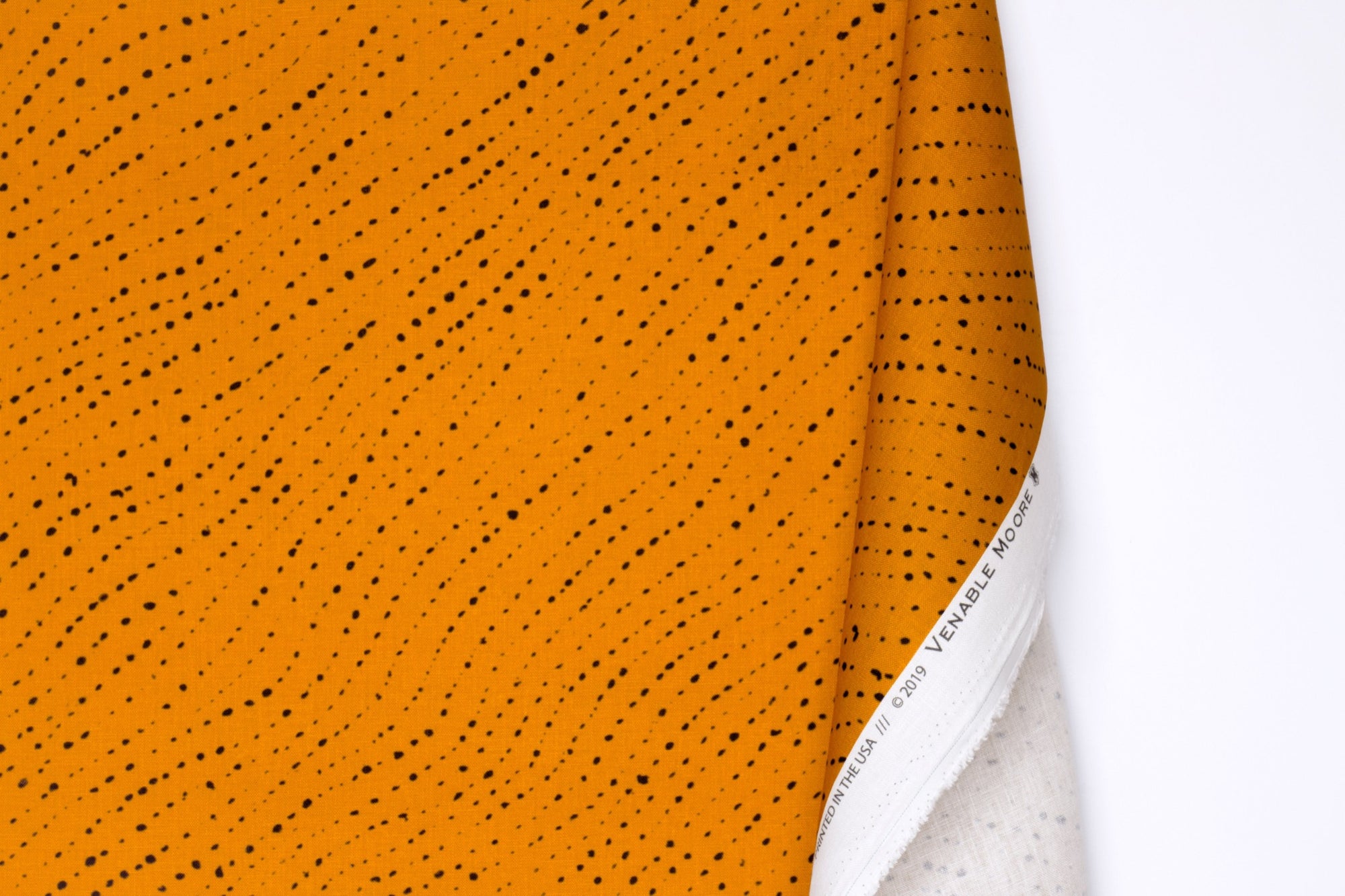 Venable Moore 100% linen staccato nero shibori fabric by the yard with long fold in marigold yellow