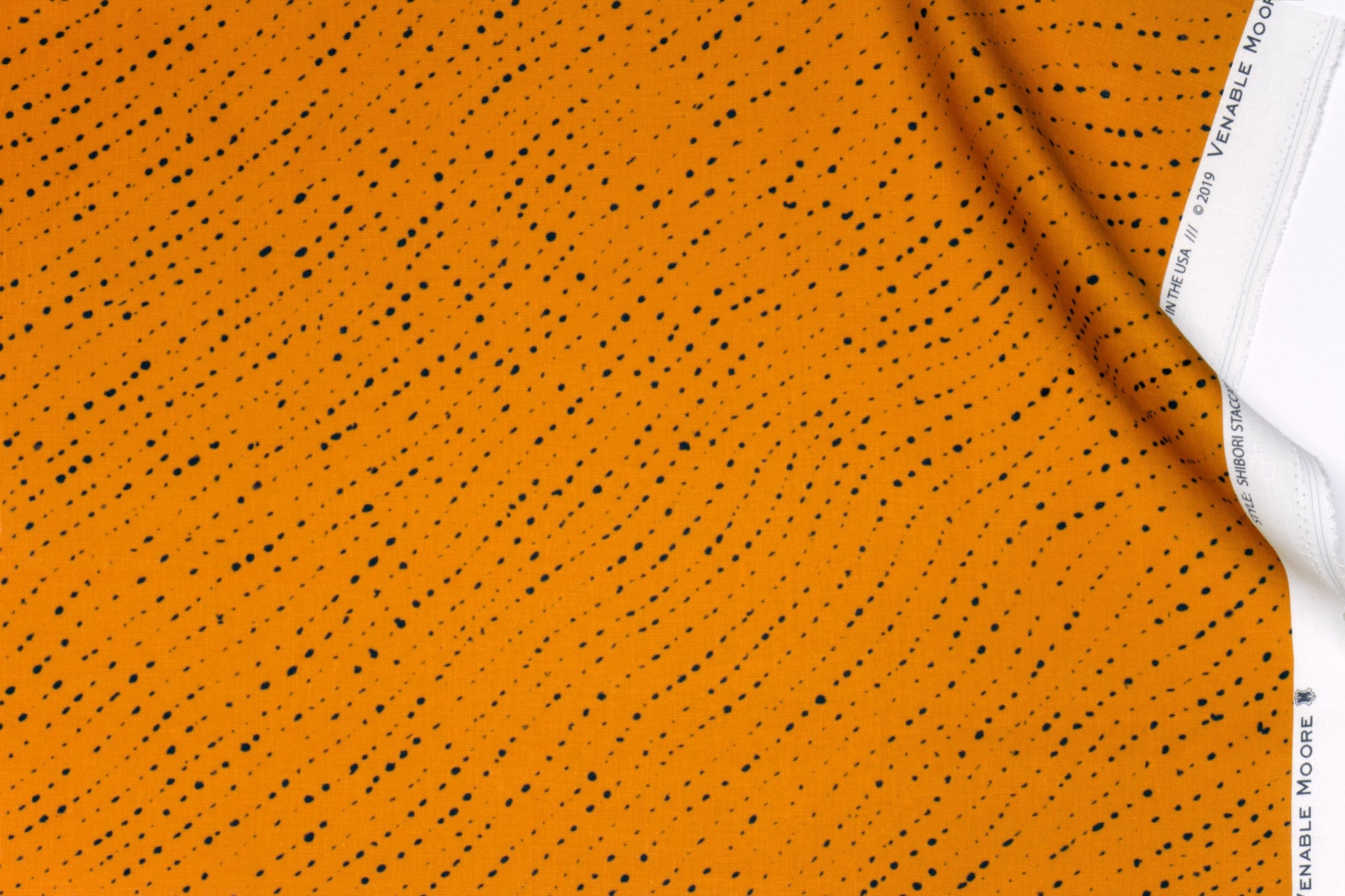 Venable Moore 100% linen staccato nero shibori fabric by the yard in marigold yellow with top fold