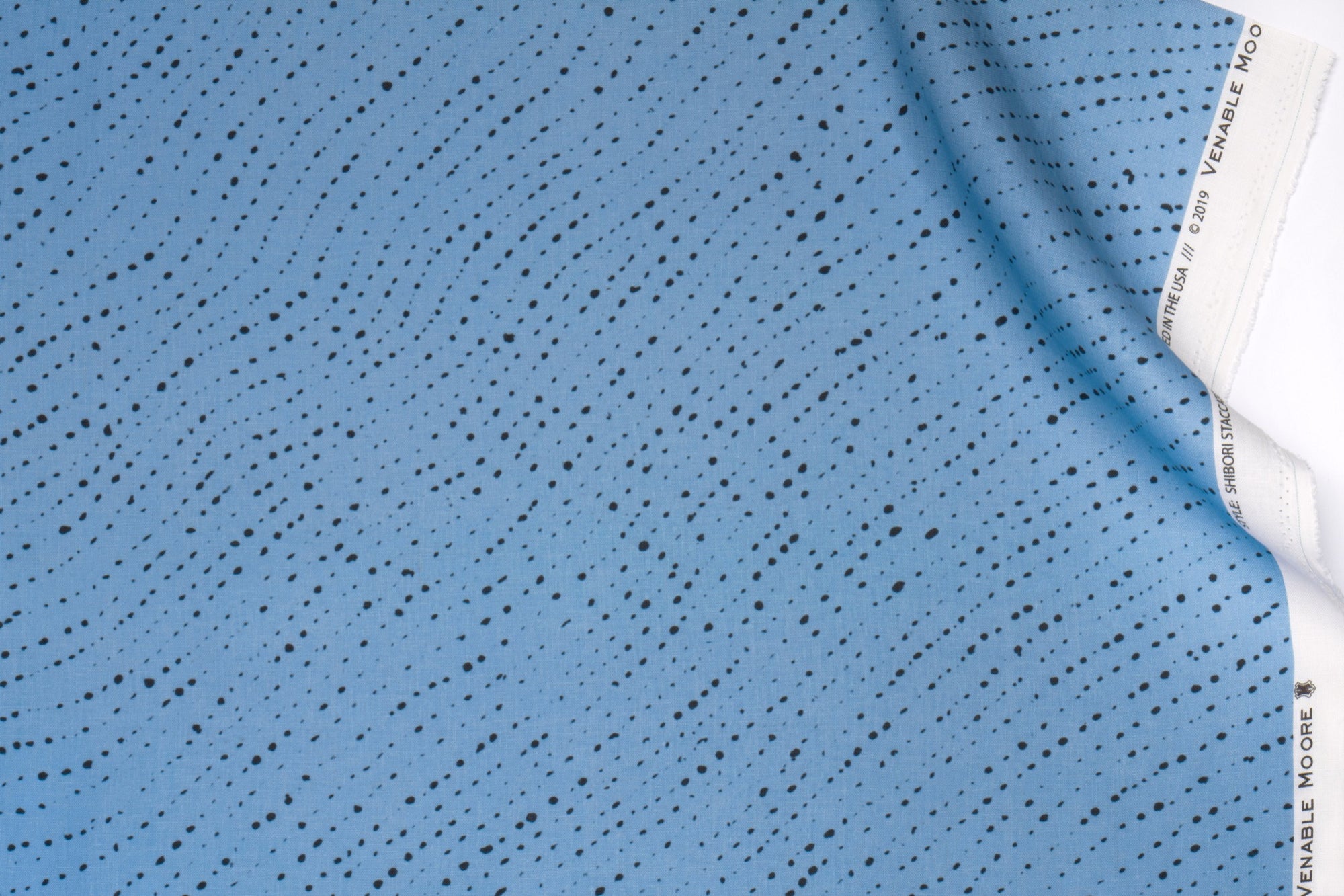 Venable Moore 100% linen staccato nero shibori fabric by the yard in sky blue with top fold