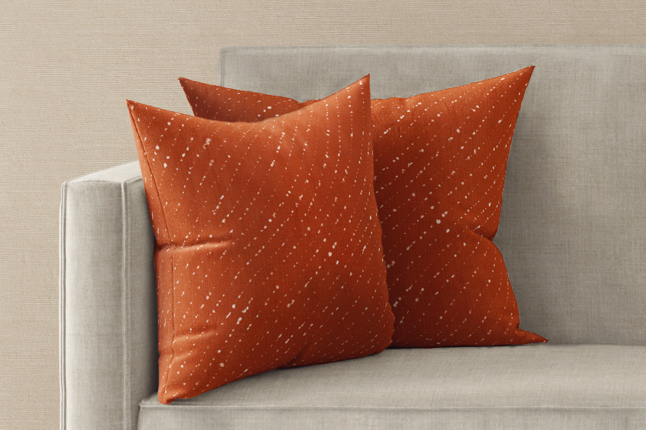 Two 'Staccato Sbiancato' Ginger linen pillow covers 20" x 20" installed on a sofa