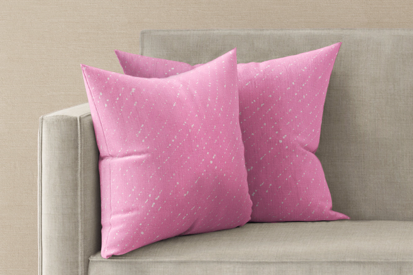 Two 'Staccato Sbiancato' hand-dyed Shibori Carnation linen pillow covers 20" x 20" installed on a sofa